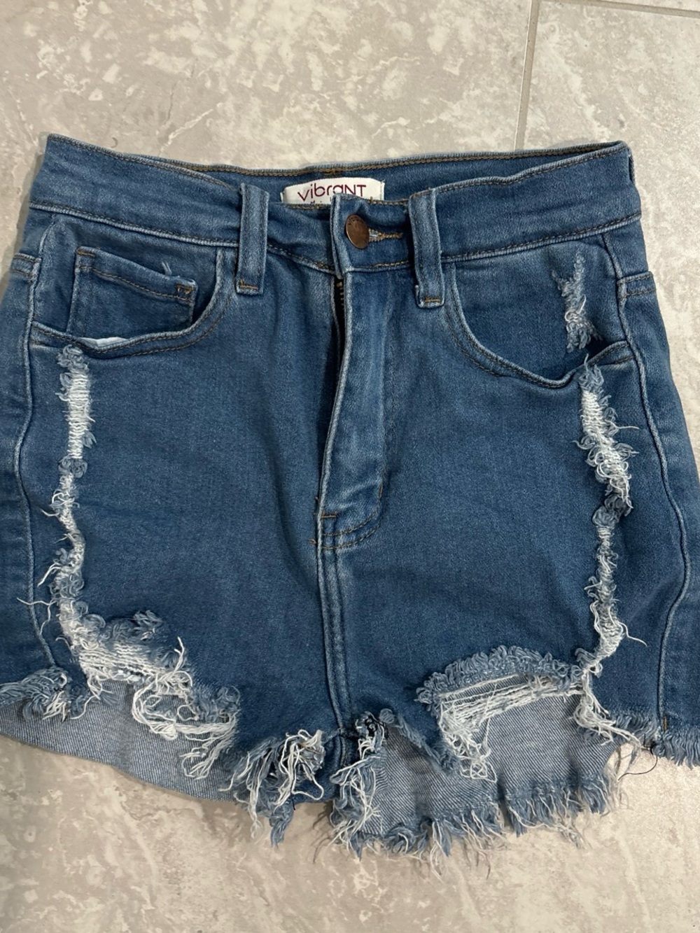 Blue jean shorts with cuts